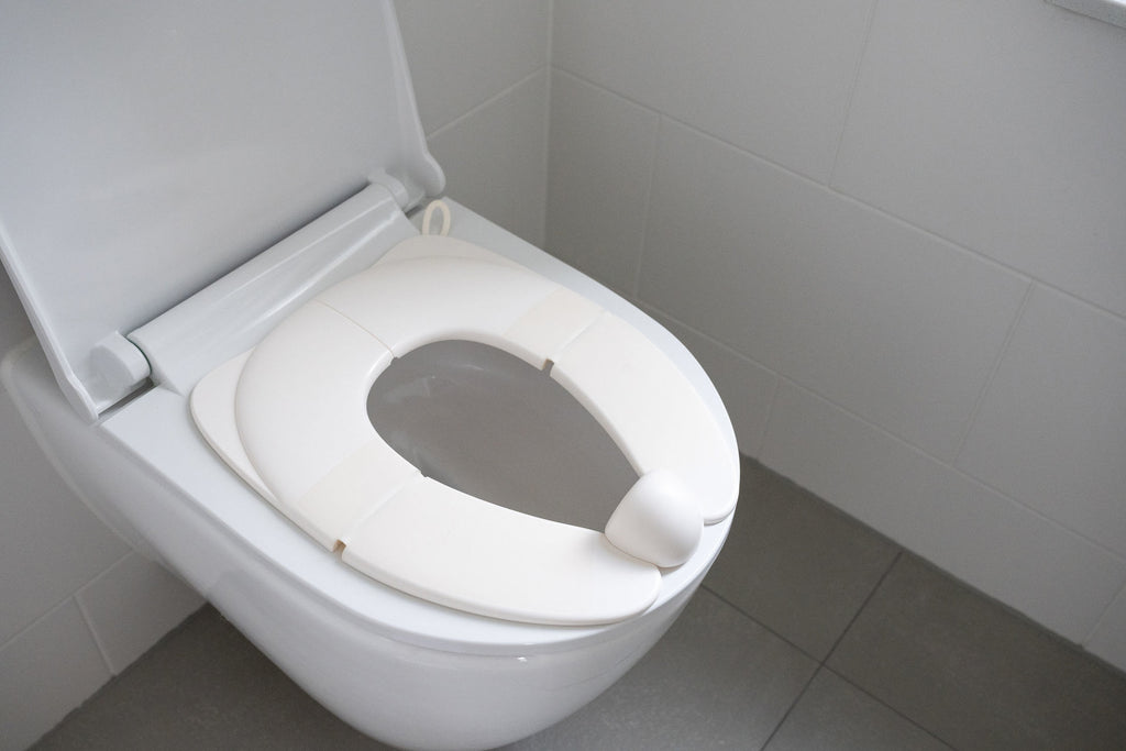 Dooky-Riduttore per sedile WC pieghevole